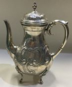 A chased Continental silver chocolate pot.