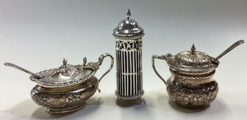 A group of three silver mustard pots.