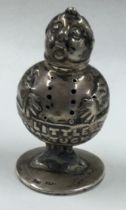 A rare silver pepper in the form of Little Tommy Tucker. Birmingham. Circa 1906.