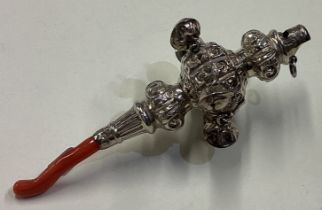 A Victorian silver rattle with coral teether.