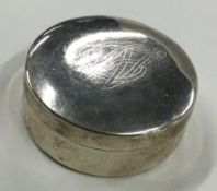 A round Sterling silver pill box with lift-off lid.