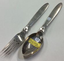 GEORG JENSEN: A silver serving spoon and fork with cactus pattern.