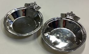 OF ROYAL INTEREST: A pair of silver ashtrays / dishes decorated with crowns.