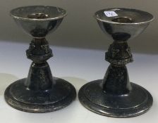A pair of silver candlesticks chased with foxes. Birmingham 1972.