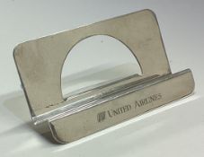 TIFFANY & CO: A large silver United Airlines menu holder.