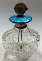 A Sterling silver and blue enamelled glass perfume bottle.