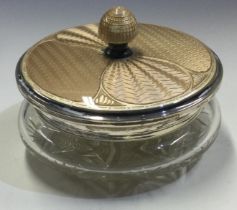 A heavy silver and brown enamelled glass jar.