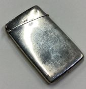 A silver card case with hinged lid. Birmingham 1909.