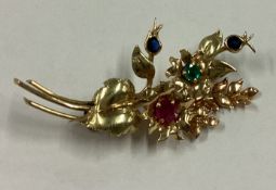 A stylish brooch in the form of a flower in 9 carat setting.
