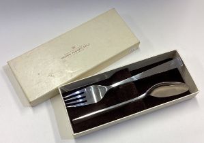 GEORG JENSEN: A silver spoon and fork with block pattern in original box.