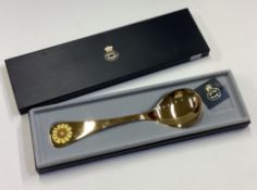 GEORG JENSEN: A cased silver gilt spoon.
