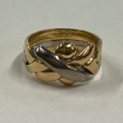 A two colour 18 carat gold signet ring.