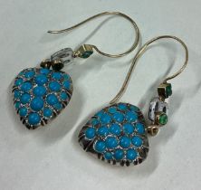 A pair of enamelled and emerald heart shape earrings.