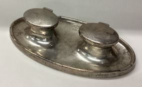 An oval silver double inkwell. Birmingham.