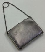 A large and heavy silver combination compact / card case.