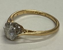 A good diamond brilliant cut single stone ring in 18 carat gold and platinum setting.