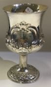A chased Victorian silver goblet embossed with flowers. London 1863.