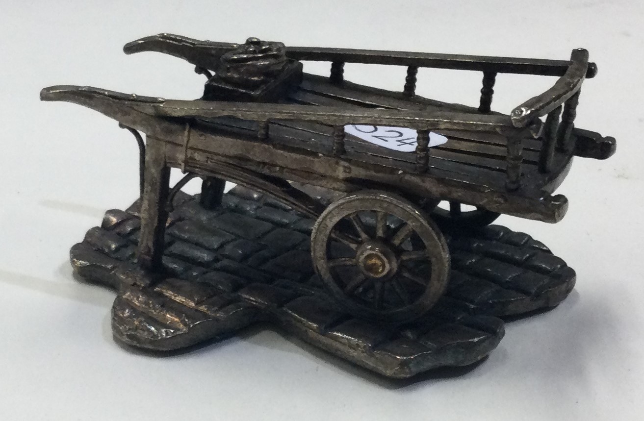 A heavy silver model of a wheelbarrow. - Image 2 of 2