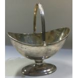 CHESTER: A silver swing handled basket. 1913.