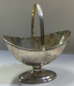 CHESTER: A silver swing handled basket. 1913.