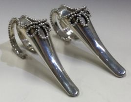 A rare pair of silver posy holders in the form of shoes. London 1955.