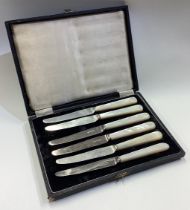 A cased set of six silver and MOP knives.