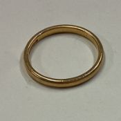 A small gold wedding band.