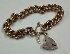A small 9 carat curb link bracelet.