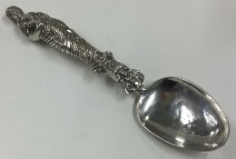 A large heavy Antique silver spoon with figural handle.
