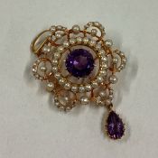 An attractive amethyst and pearl brooch / pendant with loop top.