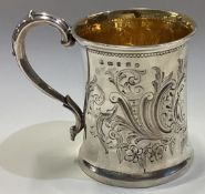 A chased Victorian silver christening tankard.