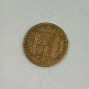 A good 1869 Half Sovereign coin.