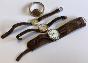 Two lady's 9 carat wristwatches together with two others.