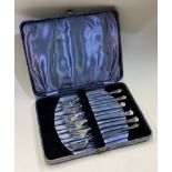 A boxed set of six silver oyster forks. Approx. 10