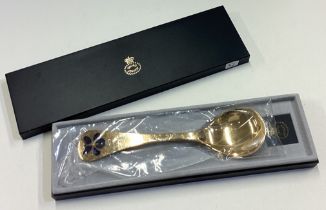 GEORG JENSEN: A cased silver gilt spoon.