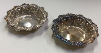 A pair of chased Victorian silver dishes. Sheffield 1909.