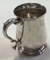 A fine and large George II silver baluster shaped tankard.