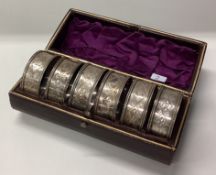 A boxed set of six silver napkin rings. Birmingham.
