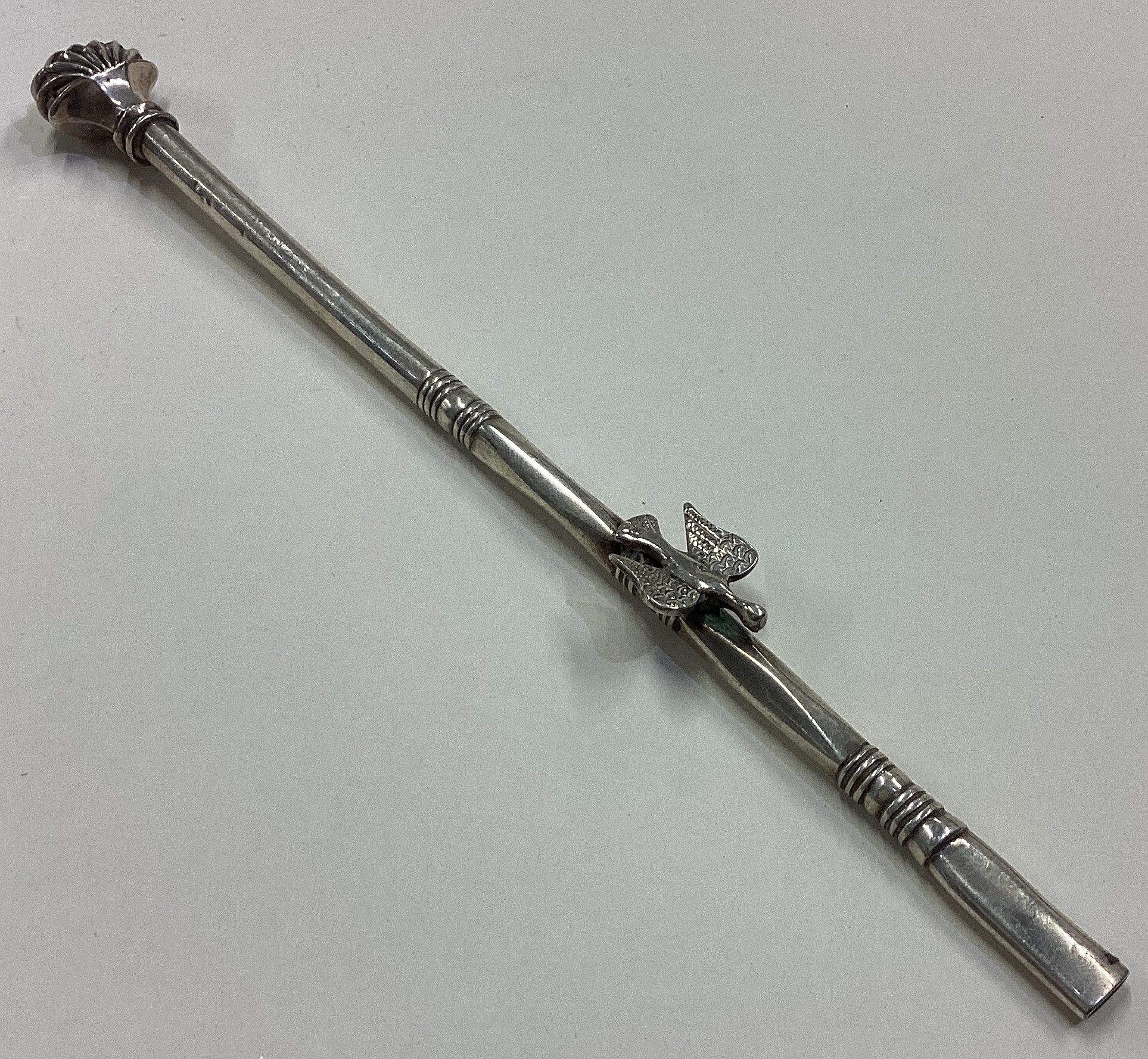 A large 19th Century Turkish silver cocktail stirrer cast with bird.