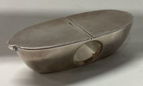 An unusual oval silver hinged top snuff box.