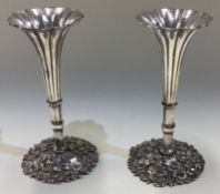 A fine pair of Japanese Meiji silver vases.