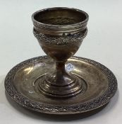 A French silver egg cup on stand.