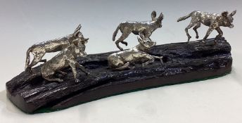 A fine set of five silver hyenas on plinth.