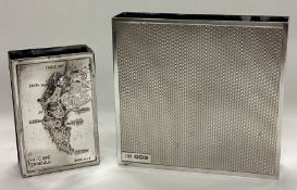 A heavy silver engine turned match case together with a plated example.