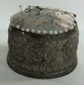 A large heavy Indian silver pin cushion.