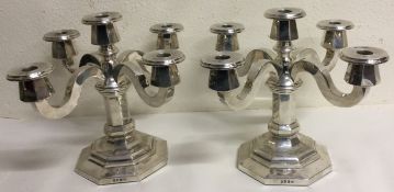 A large pair of silver candelabra. Marked to base.
