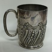 OF GOLFING INTEREST: A Victorian silver chased mug. London 1899. By FAB.