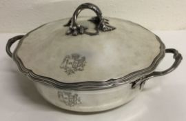 A large French silver entrée dish and cover bearing central armorial to centre. Circa 1850.