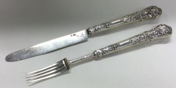 A Victorian silver knife and fork with grapevine decoration. Sheffield 1804.