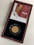 A Queen Elizabeth II 22 carat gold Proof coin numbered 0652.